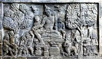 Kuvera, the god of wealth, depicted in a temple relief from ancient Java
