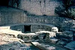 The water tank or castellum divisorum at Nîmes, into which the aqueduct emptied. The round holes were where the city's water supply pipes connected to the tank.
