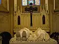 Tomb with effigies of Emperor Pedro II of Brazil and his wife Teresa Cristina in front of an altar crucifix in the Cathedral of Petrópolis, Brazil. The cross is made of black granite from Tijuca forest.[38]