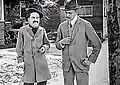 Screenshot of Charlie Chaplin (left) in scene with Henry Lehrman in "Making a Living"