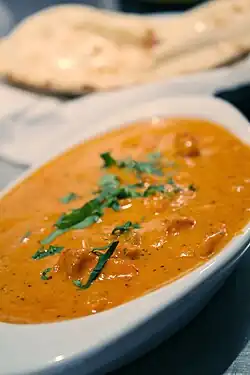 Chicken tikka masala, adapted from Indian chicken tikka and called "a true British national dish." The dish is now popular staple in Indian restaurants worldwide.[39]