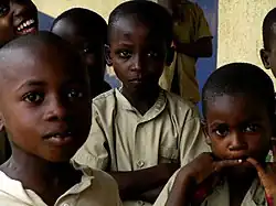 three children looking directly at camera