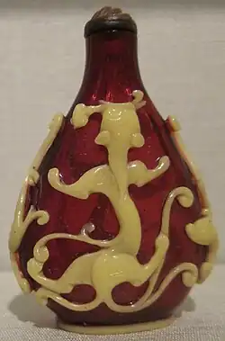 Red glass bottle with yellow glass overlay