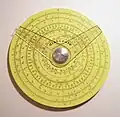 Pickett circular slide rule with two cursors. (4.25&nbsp;in/10.9&nbsp;cm width) Reverse has additional scale and one cursor.
