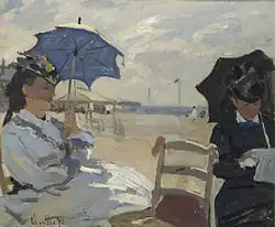 La plage de Trouville, 1870, National Gallery, London. The left figure may be Camille, on the right possibly the wife of Eugène Boudin, whose beach scenes influenced Monet.[53]