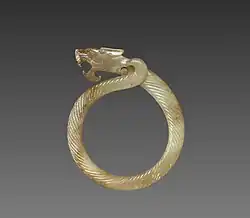 Fluted ring with a dragon head (huan); circa 475 BC; jade (nephrite); overall: 9.1 centimetres (3.6&nbsp;in); Cleveland Museum of Art (Cleveland)