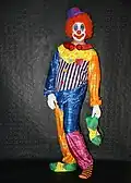 A man dressed in clown costume