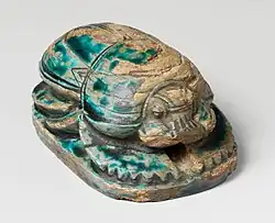 Commemorative scarab of Amenhotep&nbsp;III, recording a lion hunt; 1390–1352&nbsp;BC; blue-glazed steatite; length: 8&nbsp;cm; Metropolitan Museum of Art