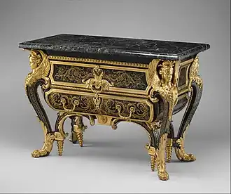 Commode; by André-Charles Boulle; c.1710–1732; walnut veneered with ebony and marquetry of engraved brass and tortoiseshell, gilt-bronze mounts, antique marble top; 87.6 x 128.3 x 62.9&nbsp;cm; Metropolitan Museum of Art (New York City)[127]