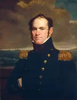 A head and chest portrait of a middle-aged man facing left wearing a high-ranked military uniform. The uniform conceals his neck; he has a determined but distant look. He has a pudgy face with prominent cheeks, and a very high balding forehead. His hair is wildly standing up, wavy, and midlength.