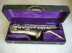 A straight-necked Conn C melody saxophone (Conn New Wonder Series 1)[53] with a serial number that dates manufacture to 1922
