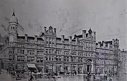 A black-and-white ink drawing of a grand building stretching across the photo with a white tower in the corner. People are walking on the very wide street in front.