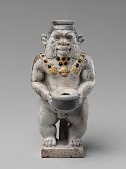 Cosmetic container; 525–404 BC; faience; height: 9.2&nbsp;cm, width: 4.4&nbsp;cm; Metropolitan Museum of Art