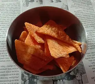 Triangle potato chips with Indian spicy flavors