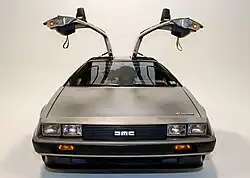 Front facing image of the DeLorean with the doors open