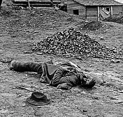 Confederate artilleryman killed during the final Union assault against the trenches at Petersburg. Photo by Thomas C. Roche, April 3, 1865.[100][101] Although prints of this picture list it as being taken at Ft Mahone, historians at the "Petersburg Project" believe it was taken at Confederate Battery 25.[102]