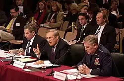 Secretary of Defense Donald Rumsfeld with Chairman of The Joint Chiefs of Staff General Richard B. Myers and Deputy Secretary of Defense Paul Wolfowitz testifying before the 9/11 Commission in March 2004