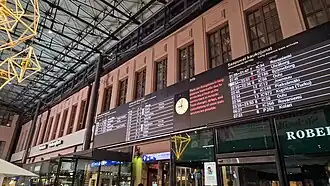 Electronic departure board at a railway station showing overnight sleeper train services, including long-distance routes to northern destinations such as Rovaniemi.