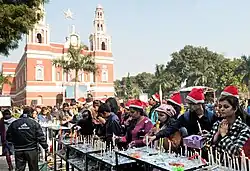 Devotees light candles and pray outside the Sacred Heart Cathedral, New Delhi on the occasion of Christmas.
