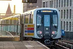 A B23 stock DLR service departing Pontoon Dock for Woolwich Arsenal