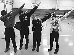 A group of teens dabbing, a popular fad and gesture of the youth around 2015–2016. Dabbing was the most prominent dance trend of the 2010s, which joined such dances as Flossing and the Harlem Shake.