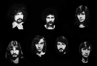 ELO in 1977. Top row left to right: Jeff Lynne, Kelly Groucutt, Bev Bevan. Bottom row left to right: Hugh McDowell, Richard Tandy, Mik Kaminski, Melvyn Gale