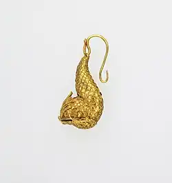 Earring in the form of a dolphin; 5th century BC; gold; 2.1 by 1.4 by 4.9 centimetres (0.83&nbsp;in ×&nbsp;0.55&nbsp;in ×&nbsp;1.93&nbsp;in); Metropolitan Museum of Art