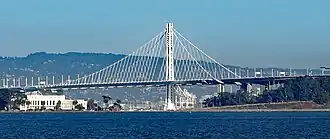 A very large suspension bridge passing over a large body of water