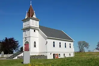 Emigrant Church in the village of Sletta on the island of Radøy in Norway. The church was built from 1908 to 1922 in Brampton, North Dakota, and moved as a gift from Norwegian emigrants in the United States in 1997.