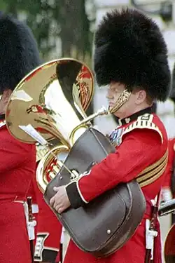 Photograph of a bandsman playing a tuba