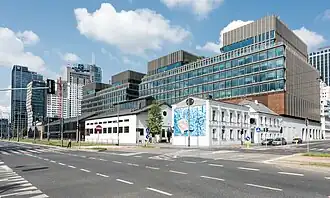 Wola, once an industrial district, is now becoming the business center of the capital.[172] The photo shows the revitalized Norblin Factory.