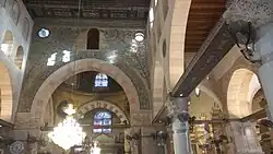 Decorated wall above mihrab near central dome facing main entrance[101]