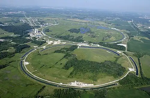 Bird's-eye view of a large circular shape inscribed into a grassy area