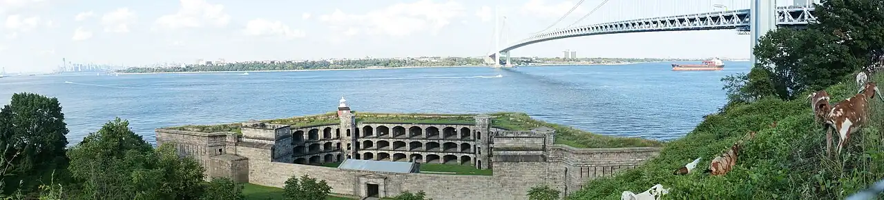 Panorama of the Upper New York Bay viewed from Fort Wadsworth in Staten Island. The Verrazzano–Narrows Bridge is visible in the center of the image and Battery Weed is visible in the foreground.