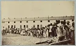Photograph of children reading books at Freedman's Village, ca. 1864-1865