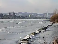 View upstream from the Donauinsel in Vienna, Austria during an unusually cold winter (February 2006), as the river rarely freezes there.[citation needed]