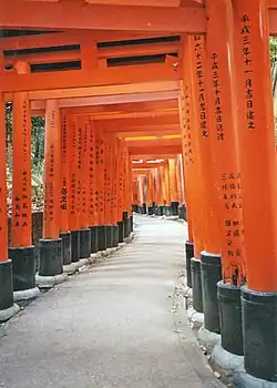 Red torii along a path at the Fushimi Inari shrine in Kyoto