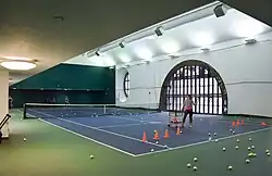 Tennis players using the terminal's court