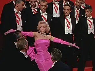 Pink combined with black or violet is associated with seduction. Marilyn Monroe in the trailer for the film Gentlemen Prefer Blondes (1953).