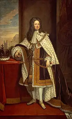 An oil portrait of George I in his coronation robes, holding the orb in his right hand and an unknown sword in his left hand. On the table to his right is the Imperial State Crown of George I.