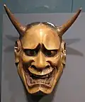 Japanese wooden mask depicting demon