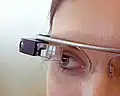 Wearable computers, like Google Glass in the image, may use voice user interface