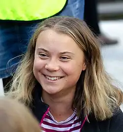 Greta Thunberg has balayage hair, she smiles.