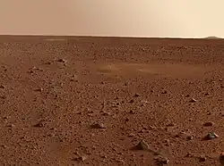 view of Martian desert showing rock field to the horizon