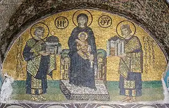 10th-century Hagia Sophia mosaic depicting the Virgin Mary holding Christ on her lap. On her right side stands Justinian, offering a model of the Hagia Sophia. On her left, Constantine I presents a model of Constantinople.