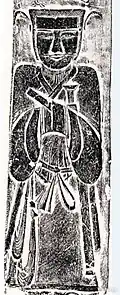 Military official depicted on Han dynasty stone relief found in Deng county, Henan. Wuguan hat with pheasant-tail decorations denominates martial status.[後漢書 5][76]