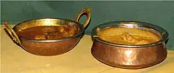 Traditional Indian karahi (left) and handi (right) serving dishes