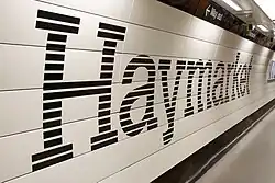 A platform at Haymarket, branded in the new corporate colour scheme.
