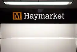 Station signage at Haymarket, branded in the new corporate colour scheme.