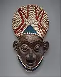 Royal mask; by artists of the Bamum people (Cameroon); before 1880; wood, copper, glass beads, raffia and shells; height: 66&nbsp;cm; Metropolitan Museum of Art[109]